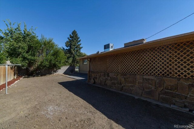 view of property exterior with a fenced backyard
