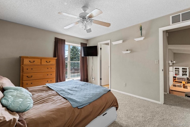 bedroom featuring carpet flooring, a textured ceiling, visible vents, baseboards, and ceiling fan