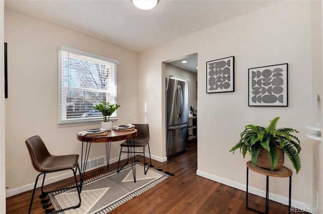 hallway featuring dark hardwood / wood-style flooring