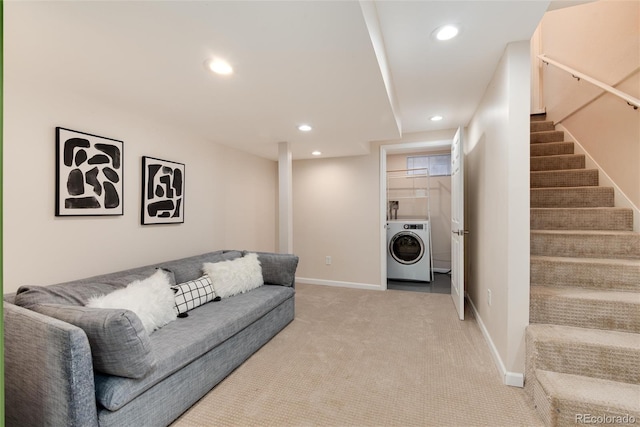 carpeted living room with washer / clothes dryer