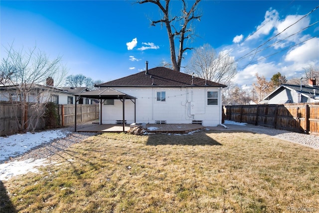 rear view of house featuring a gazebo, a patio, and a lawn