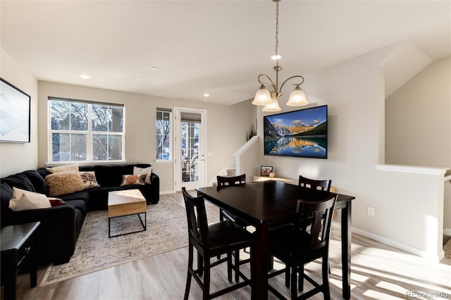 dining area with stairway, recessed lighting, baseboards, and wood finished floors