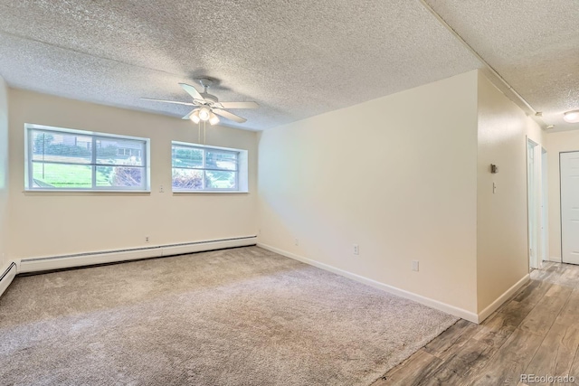 1400 Golden Cir Unit 102, Golden, CO 80401 - spare room featuring a ceiling fan, a textured ceiling, baseboard heating, and wood finished floors