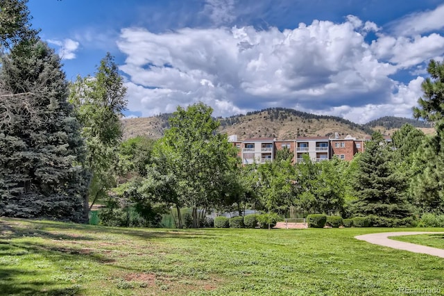 1400 Golden Cir Unit 102, Golden, CO 80401 - surrounding community featuring a mountain view and a lawn