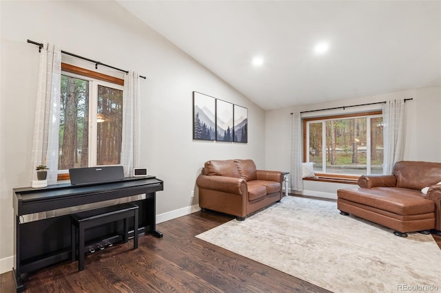 17540 Caribou Dr, Monument, CO 80132 - living room with lofted ceiling, baseboards, dark wood-style flooring, plenty of natural light, and recessed lighting