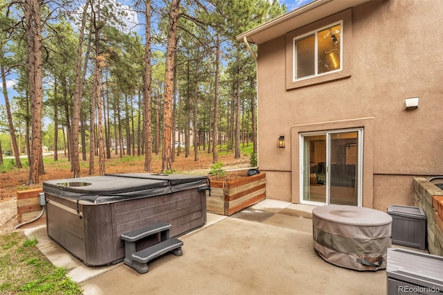17540 Caribou Dr, Monument, CO 80132 - view of patio / terrace with a hot tub
