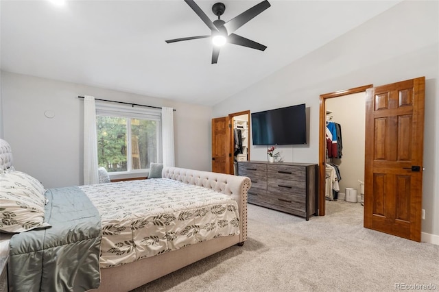17540 Caribou Dr, Monument, CO 80132 - bedroom with a walk in closet, a closet, light colored carpet, vaulted ceiling, and ceiling fan