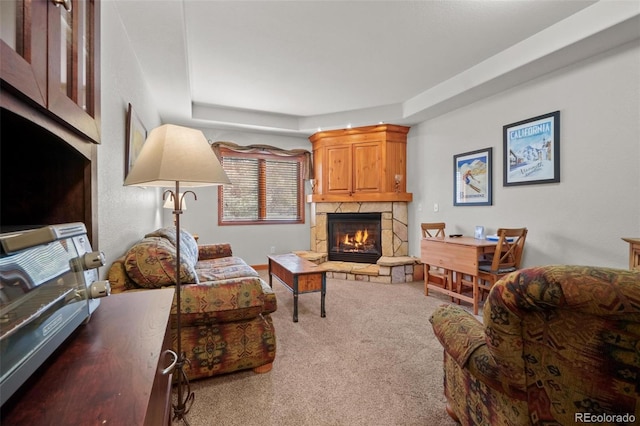 living room with carpet flooring and a raised ceiling