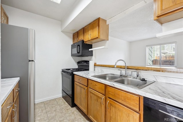 kitchen with sink and black appliances