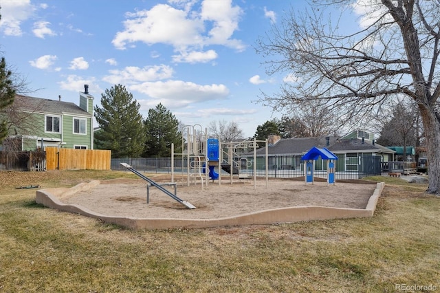 view of jungle gym featuring a lawn