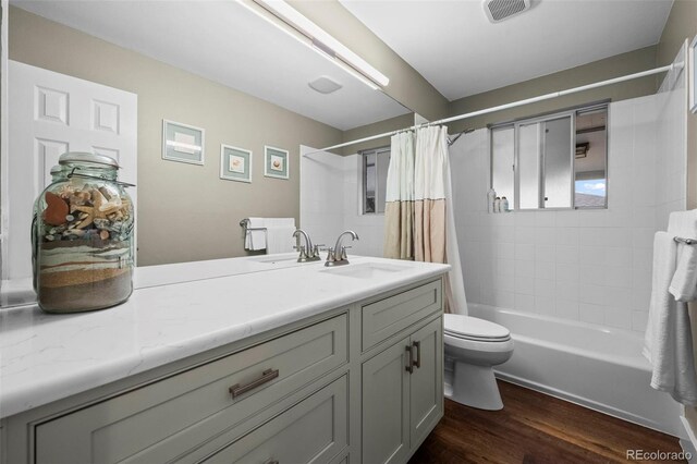 5320 W 62nd Ave, Arvada, CO 80003 - full bathroom featuring vanity, wood finished floors, and shower / bath combination with curtain