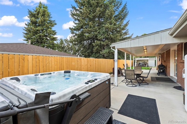 5320 W 62nd Ave, Arvada, CO 80003 - fenced backyard featuring area for grilling, outdoor dining space, a patio, and a hot tub