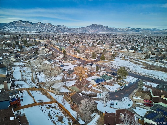 snowy aerial view featuring a mountain view