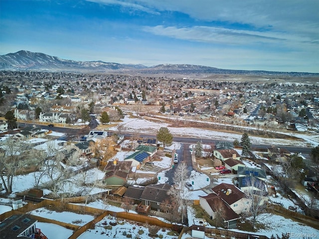 snowy aerial view with a mountain view