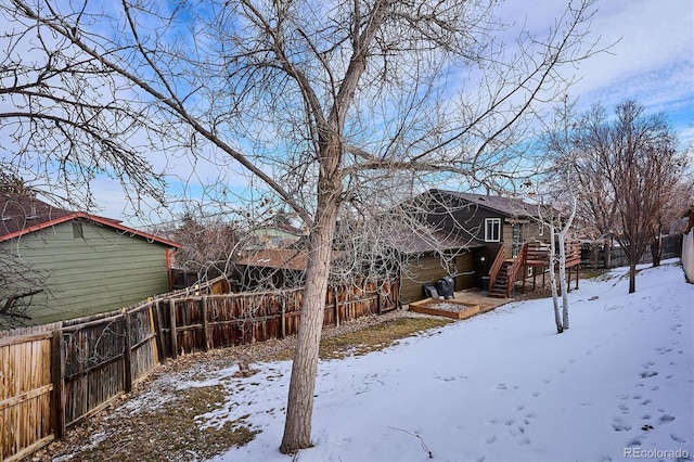 view of yard layered in snow