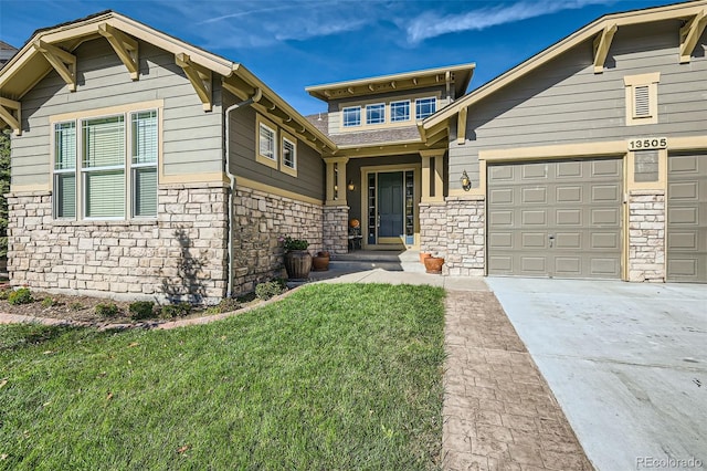 craftsman-style home featuring a front lawn and a garage