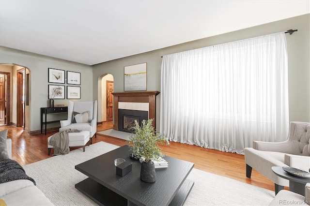 4000 Irving St, Denver, CO 80211 - living area with arched walkways, wood finished floors, and a tile fireplace