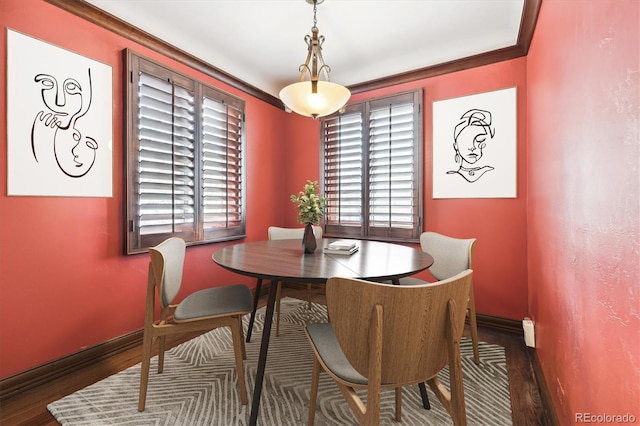 4000 Irving St, Denver, CO 80211 - dining space with wood finished floors, baseboards, and ornamental molding