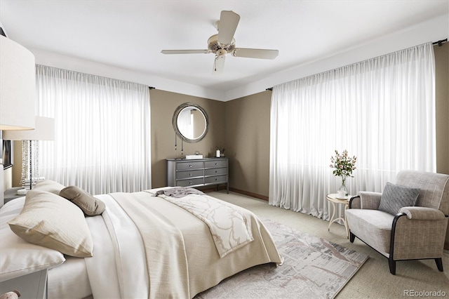 4000 Irving St, Denver, CO 80211 - bedroom with multiple windows, light carpet, baseboards, and ceiling fan