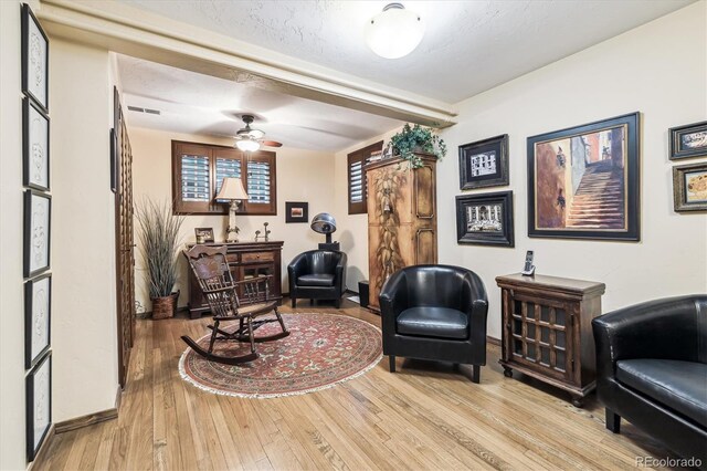 4000 Irving St, Denver, CO 80211 - living area with light wood-style floors, a ceiling fan, and baseboards