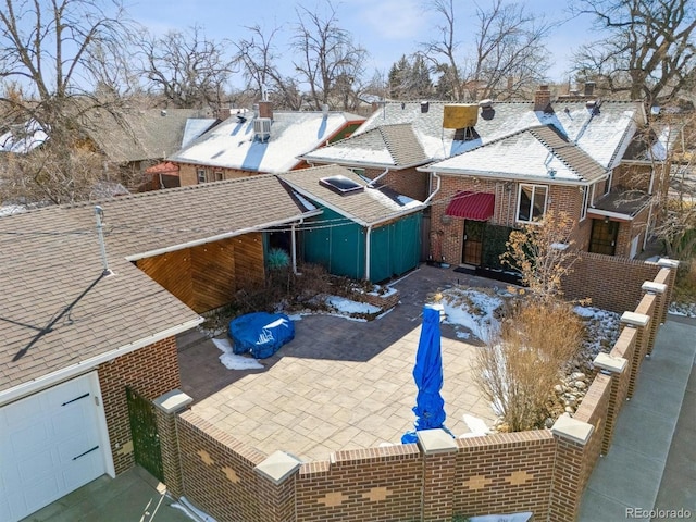 4000 Irving St, Denver, CO 80211 - view of property exterior featuring brick siding, a garage, and a patio area