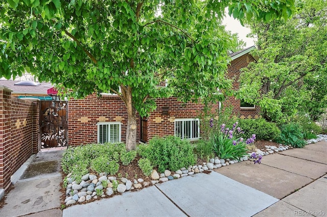 4000 Irving St, Denver, CO 80211 - view of side of property featuring brick siding and a patio