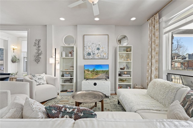 living area featuring a ceiling fan and recessed lighting