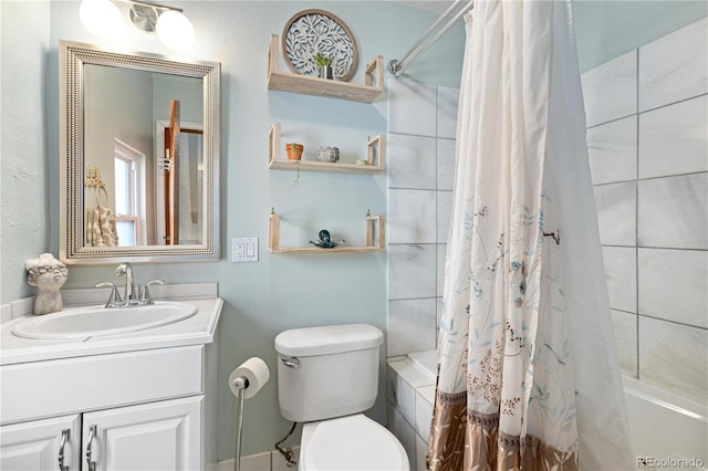 full bathroom with tiled shower / bath combo, vanity, and toilet