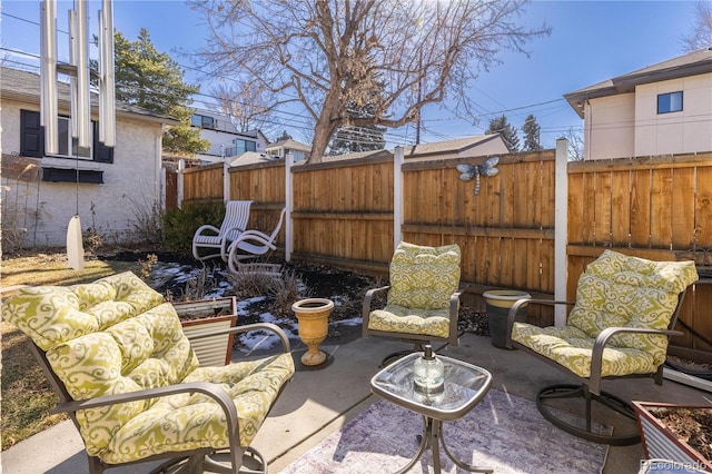 view of patio / terrace featuring fence