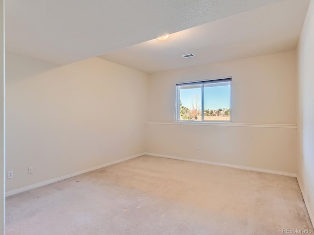 view of carpeted spare room