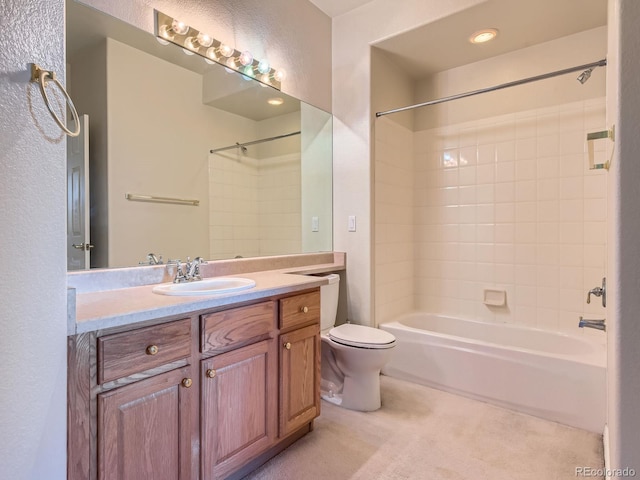 full bathroom with vanity, toilet, and tiled shower / bath combo