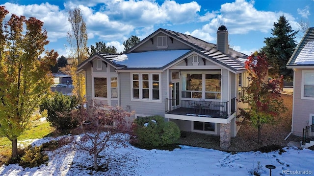 view of snow covered house