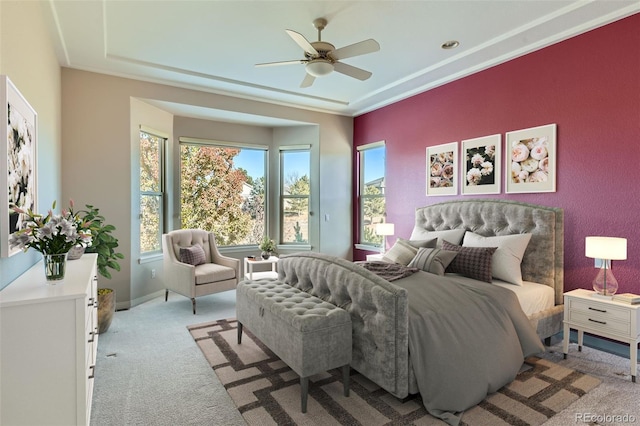 bedroom featuring ceiling fan, baseboards, and light colored carpet