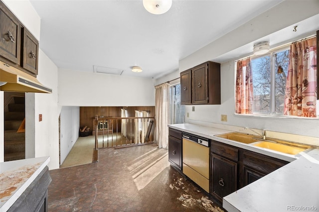 kitchen with a sink, dark brown cabinetry, dishwasher, and light countertops