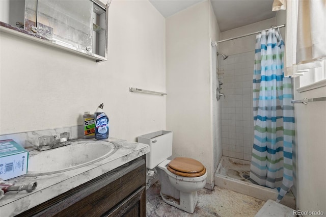 full bath with a stall shower, toilet, and vanity