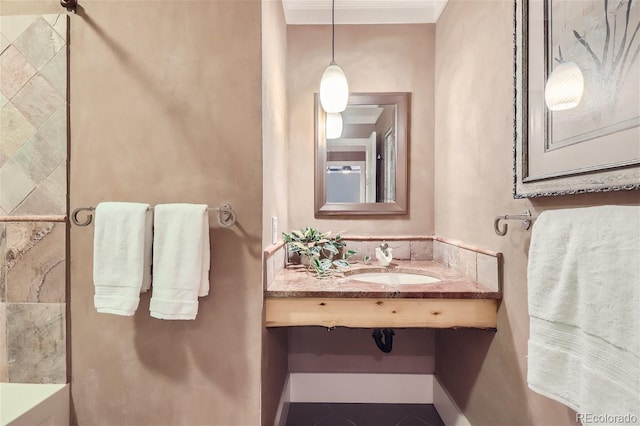 bathroom with a sink and tile patterned flooring