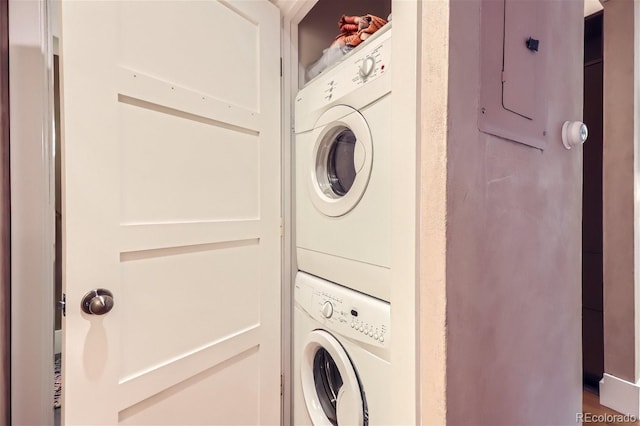 washroom with stacked washer and dryer