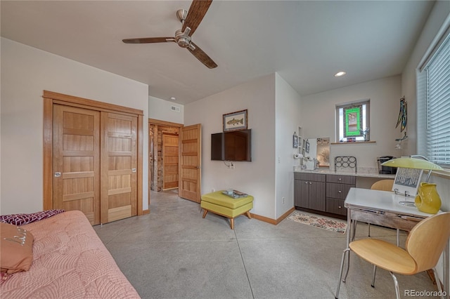 bedroom featuring ceiling fan and a closet