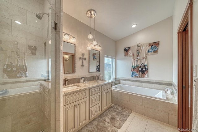 bathroom with independent shower and bath, vaulted ceiling, tile patterned floors, and vanity