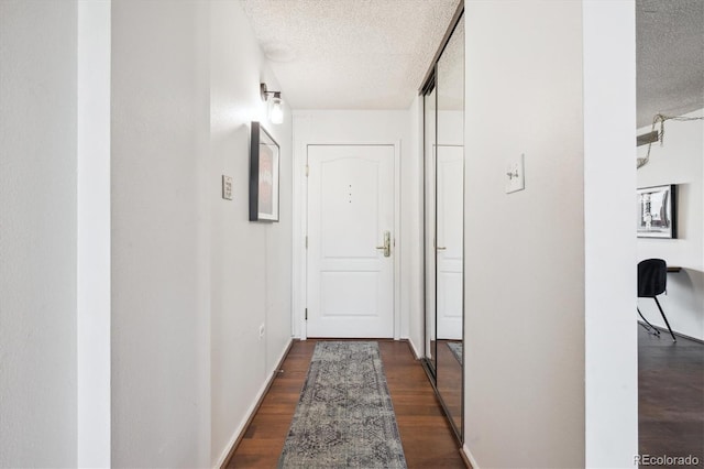 1020 15th St Unit 28G, Denver, CO 80202 - hall with a textured ceiling and dark wood finished floors