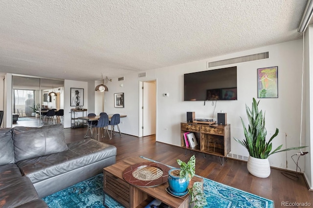 1020 15th St Unit 28G, Denver, CO 80202 - living room with a textured ceiling and wood finished floors