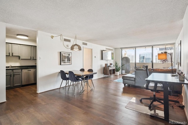 1020 15th St Unit 28G, Denver, CO 80202 - office area with a textured ceiling, dark wood-type flooring, and expansive windows