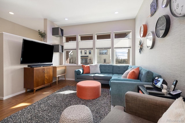 living room with recessed lighting, wood finished floors, and baseboards