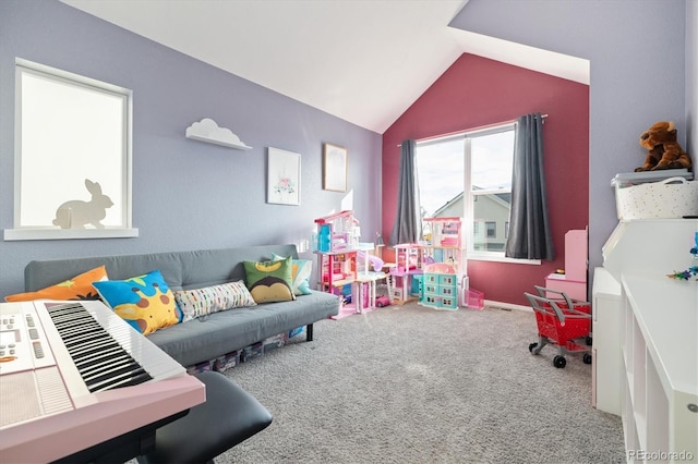 playroom featuring lofted ceiling and carpet