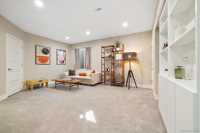 living area with carpet, visible vents, baseboards, and recessed lighting