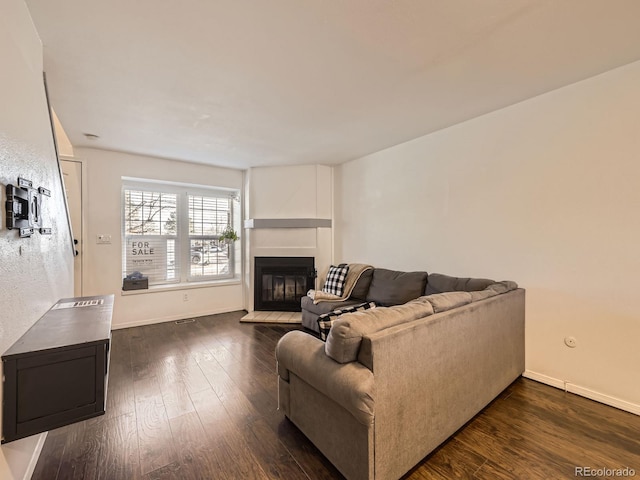 living room featuring dark hardwood / wood-style flooring