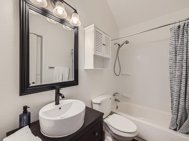 full bathroom featuring sink, vaulted ceiling, shower / bath combination with curtain, and toilet