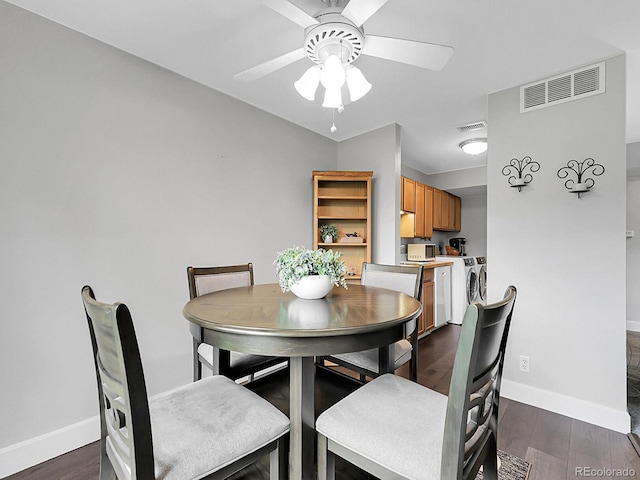 7318 S Xenia Cir Unit B, Centennial, CO 80112 - dining room featuring washer and clothes dryer, dark wood finished floors, and a ceiling fan
