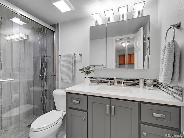 7318 S Xenia Cir Unit B, Centennial, CO 80112 - full bath with vanity, a stall shower, and decorative backsplash