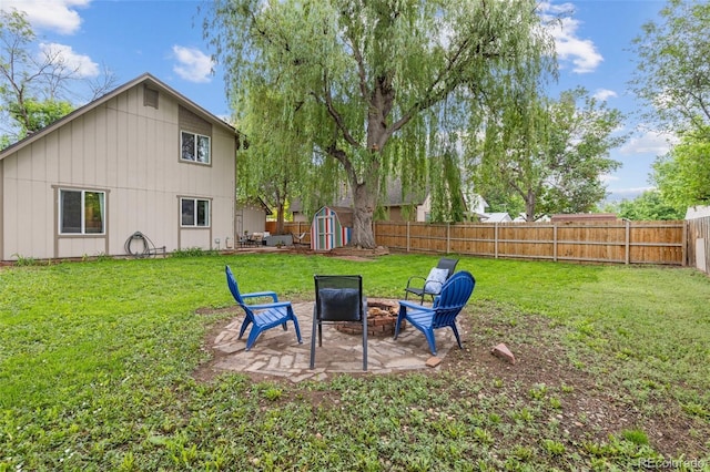 32 Powder Horn Pl, Longmont, CO 80504 - fenced backyard featuring an outdoor fire pit, a shed, and a patio area